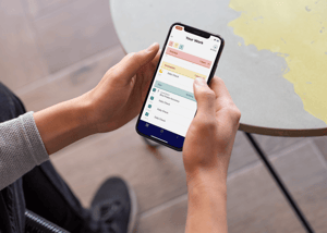 mockup-of-an-iphone-xs-held-by-a-man-outside-25532 (2)